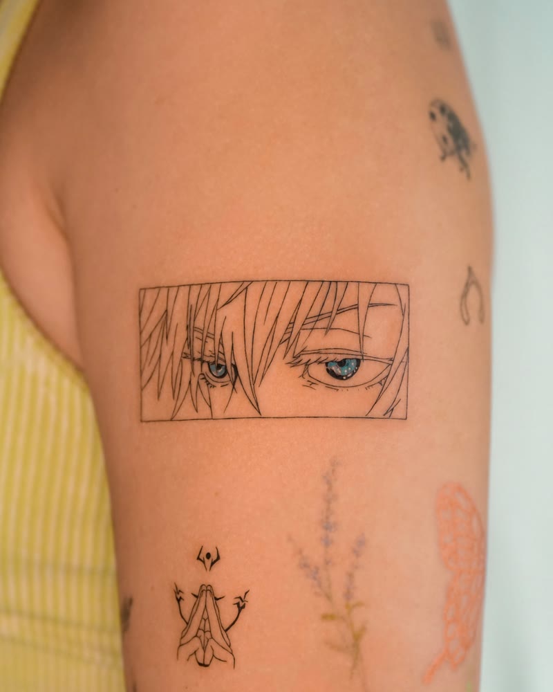 Gojo Satoru eyes anime tattoo with blue detail